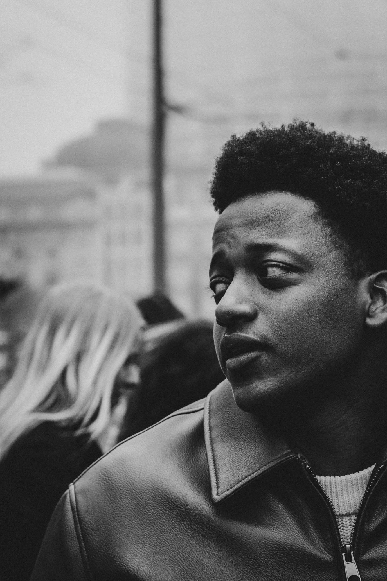 Black and white portrait on a city street